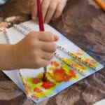 easy fall art projects for elementary school first grader painting leaves on a birch tree