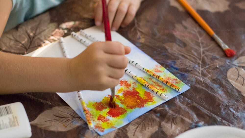 easy fall art projects for elementary school first grader painting leaves on a birch tree