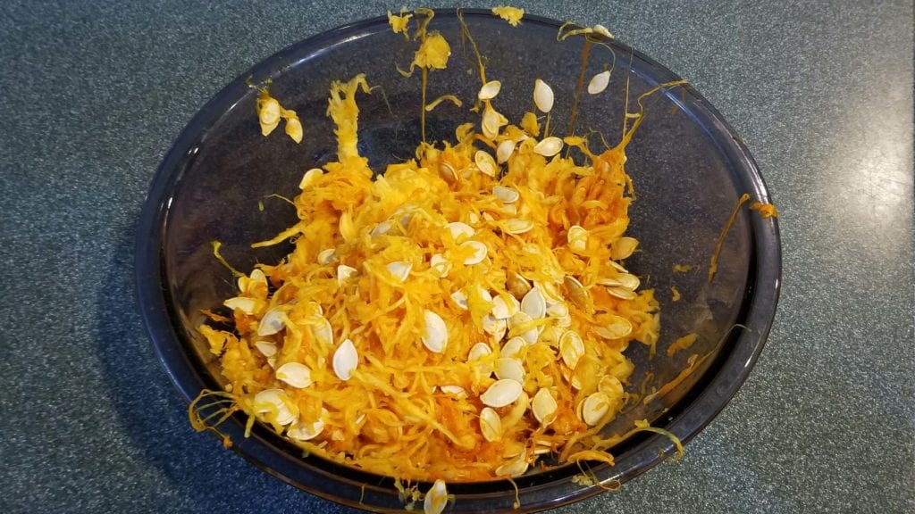 How to Clean Pumpkin Seeds Easy Tip start with a big bowl to collect your pumpkin guts.