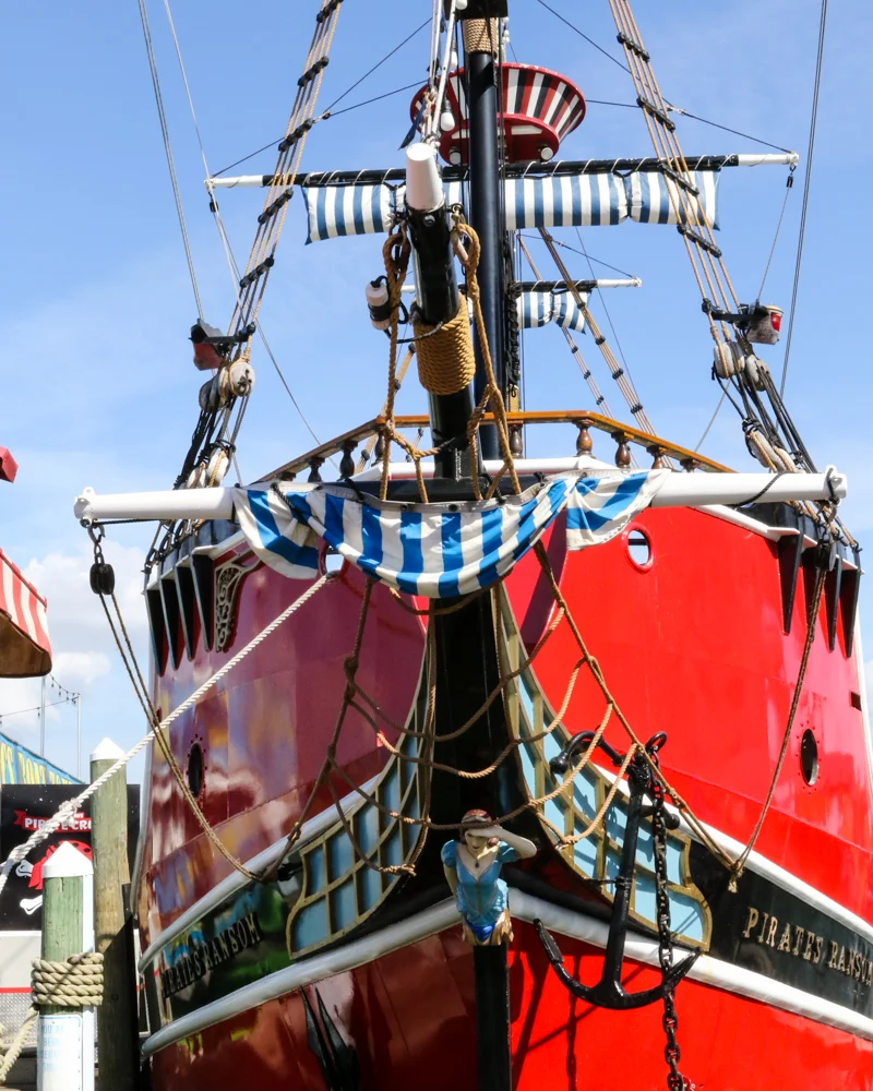 Captain Memo's Pirate Cruise Clearwater Beach red and black pirate ship with crows nest