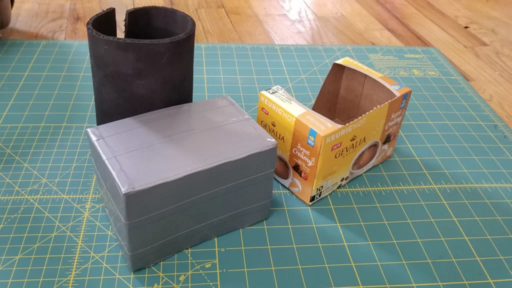 Use duct tape to reinforce cardboard boxes used in DIY costume robot shoes